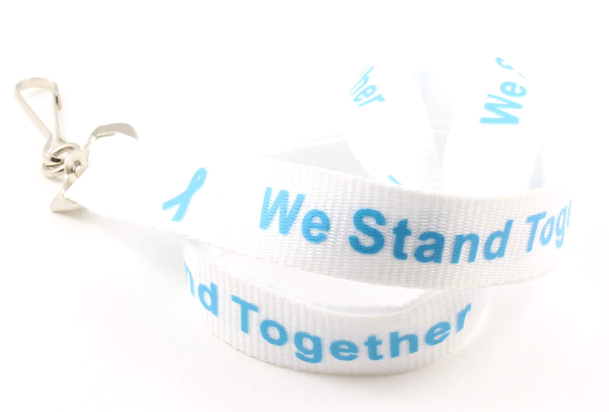 White lanyard with light blue "We Stand Together" text and light blue awareness ribbons