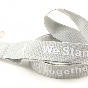 Gray lanyard with white "We Stand Together" text and white awareness ribbons